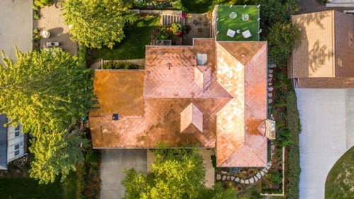 Copper diamond shingles with snow hooks on roof in Minnesota